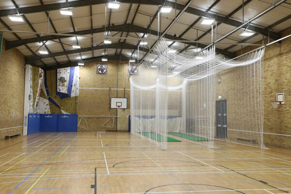Inside Wells Cathedral School Sports Hall with nets up